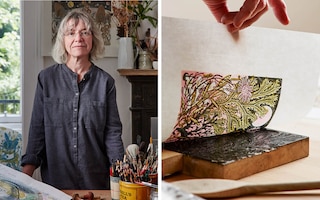 Artist Angie Lewin in her studio with a woodblock print 