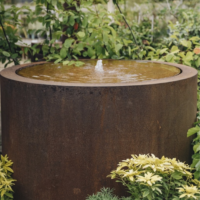 Circular drum-shaped corten steel water feature